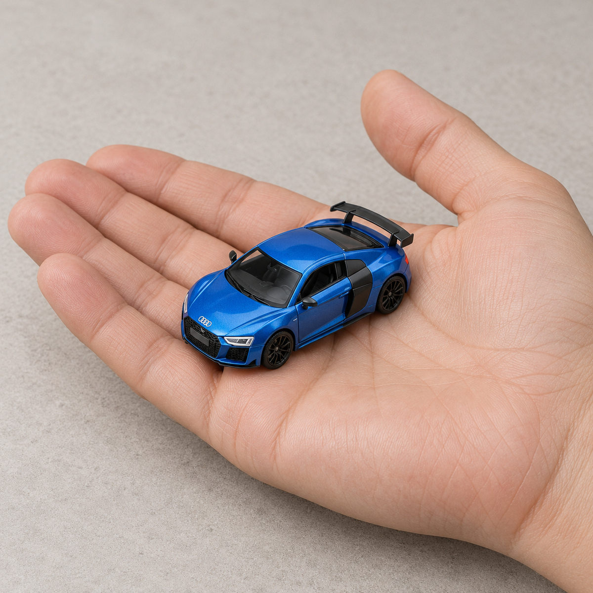 Custom blue Audi miniature held in a hand